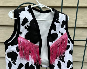 Cowgirl vest in black and white with long pink fringe. Cowgirl vest, black and white cow print cowgirl vest,