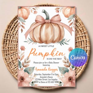 May include: Baby shower invitation with a watercolour pumpkin and pink bow. The text reads "A Sweet Little Pumpkin Is On The Way" and includes details for Amanda Rayyes' baby shower, including the date, time, and location.