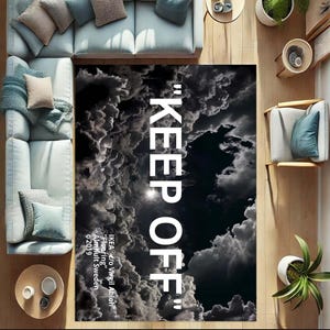 May include: Black and white rug with a cloud pattern and the text "KEEP OFF" in white. The text is attributed to IKEA@c/o Virgil Abloh, "Flooring", Almhult Sweden, 2019.