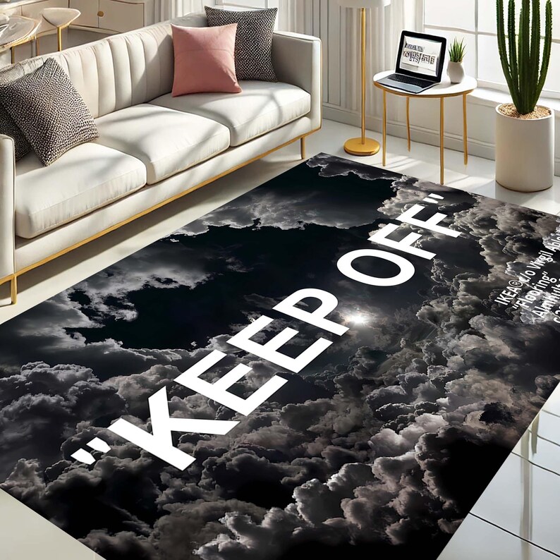 May include: Black and white area rug with a cloud pattern and the text "KEEP OFF" in large white letters.