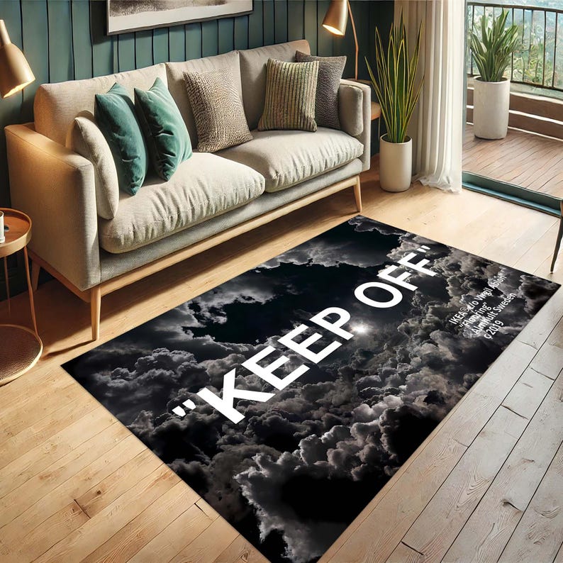 May include: Black and white area rug with a cloud pattern and the text "KEEP OFF" in white. The text "Wears to my Death" is also visible in smaller white text.