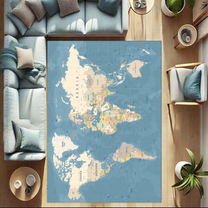 May include: A large, rectangular area rug featuring a world map design. The map is in muted tones of blue, beige, and various colors for the countries. The rug is placed on a wooden floor, surrounded by furniture.