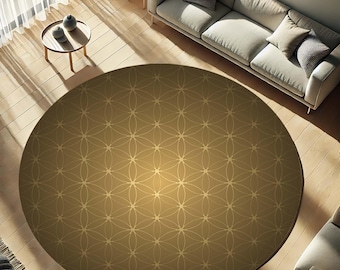 May include: A large, round area rug with a golden-brown hue and a repeating geometric pattern. The rug is centered in a room with hardwood floors, a light-colored sofa, and small side tables. The pattern is a series of overlapping circles.
