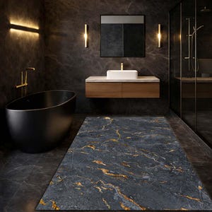 May include: A contemporary bathroom featuring a black oval bathtub, a floating wooden vanity with a white rectangular sink, and a dark grey marble floor with gold veining. The walls are dark grey, and the room has gold fixtures.