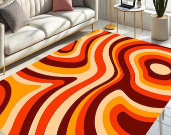 May include: Abstract area rug with a swirling pattern of orange, red, and brown lines on a cream background.