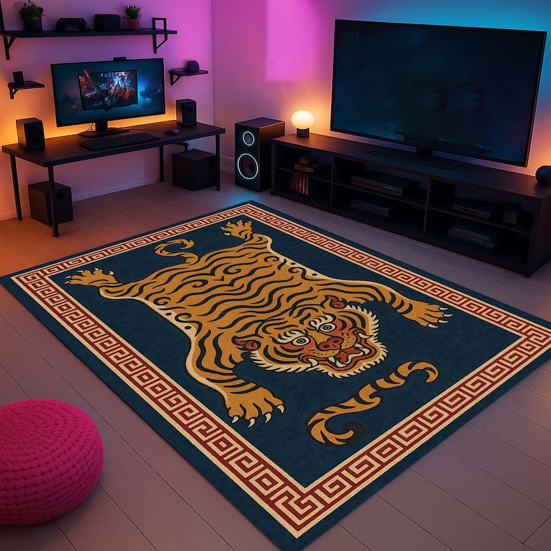 May include: A rectangular rug with a tiger design. The rug features a navy blue background with a detailed illustration of a tiger in shades of gold, brown, and cream. The border is a repeating geometric pattern in red and cream.