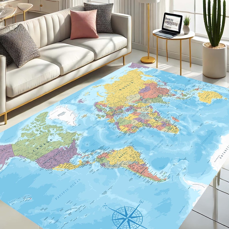 May include: A large, rectangular area rug featuring a detailed world map design. The rug displays continents in various colors against a blue ocean background. A compass rose is at the bottom. The rug is placed in a living room setting.
