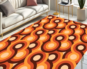 May include: A retro-style area rug with a repeating pattern of orange, brown, and cream colored circles and swirls.