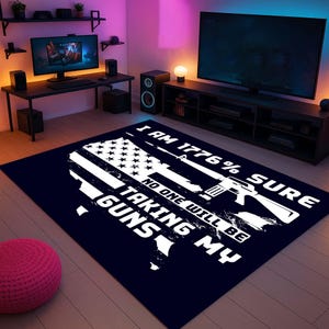 May include: A navy blue rectangular rug featuring a white American flag design with the text "I AM 1776% SURE NO ONE WILL BE TAKING MY GUNS." The design includes a rifle and the outline of the United States.