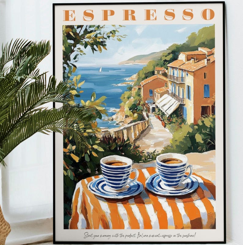 May include: A vintage-style poster with the word "ESPRESSO" in orange letters. The poster features a colorful illustration of a seaside town with a cafe table and two cups of coffee. The text at the bottom reads "Start your morning with the perfect Italian moment - espresso in the sunshine!"