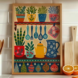 May include: A framed kitchen-themed art print featuring colorful potted plants, utensils, and a teapot. The artwork includes a variety of decorative elements in shades of red, blue, yellow, and green. The print is displayed near wooden cutting boards and fresh oranges.