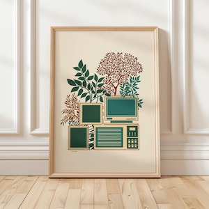 May include: A framed art print featuring a retro computer design with green screens and a beige base. The artwork includes illustrations of green foliage and a brown tree, set against a cream background. The frame is made of light-colored wood.