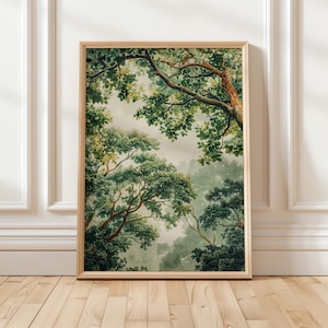 May include: A framed art print featuring a lush forest scene. The artwork showcases a vibrant display of green foliage, with tree branches and leaves filling the frame. The artwork is set in a light wooden frame.