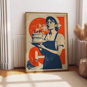 May include: A framed poster featuring a vintage-style illustration. The artwork depicts a person holding a cake on a plate, set against a red and beige background. The text "FOR G" is visible. The person is wearing a white cap and apron.