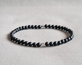 Pulsera de ónix negro mate, cuentas de plata de ley, sanación energética.