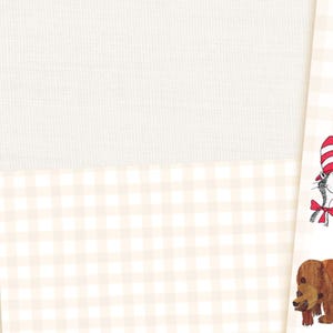 May include: A baby shower invitation card featuring a light beige gingham pattern and illustrations of classic storybook characters. The text reads: a new chapter begins, please join us for a baby shower honoring OLIVIA HUDSON, SEPTEMBER 16, 1.30-4.30PM.