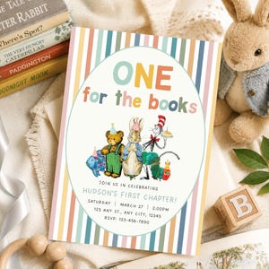 May include: A rectangular birthday invitation card featuring vertical pastel stripes and a central oval containing the text ONE for the books. Illustrations include a fish, bear, rabbit, cat, and caterpillar wearing party hats. Text includes HUDSON'S FIRST CHAPTER, date, time, address, and RSVP details.