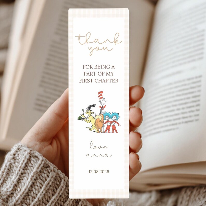 May include: A rectangular bookmark with a light beige gingham pattern. The bookmark features the text "thank you" in a cursive font, followed by "FOR BEING A PART OF MY FIRST CHAPTER." Below is a colorful illustration of Dr. Seuss characters. The bookmark also includes the text "love anna" and the date 12.08.2026.