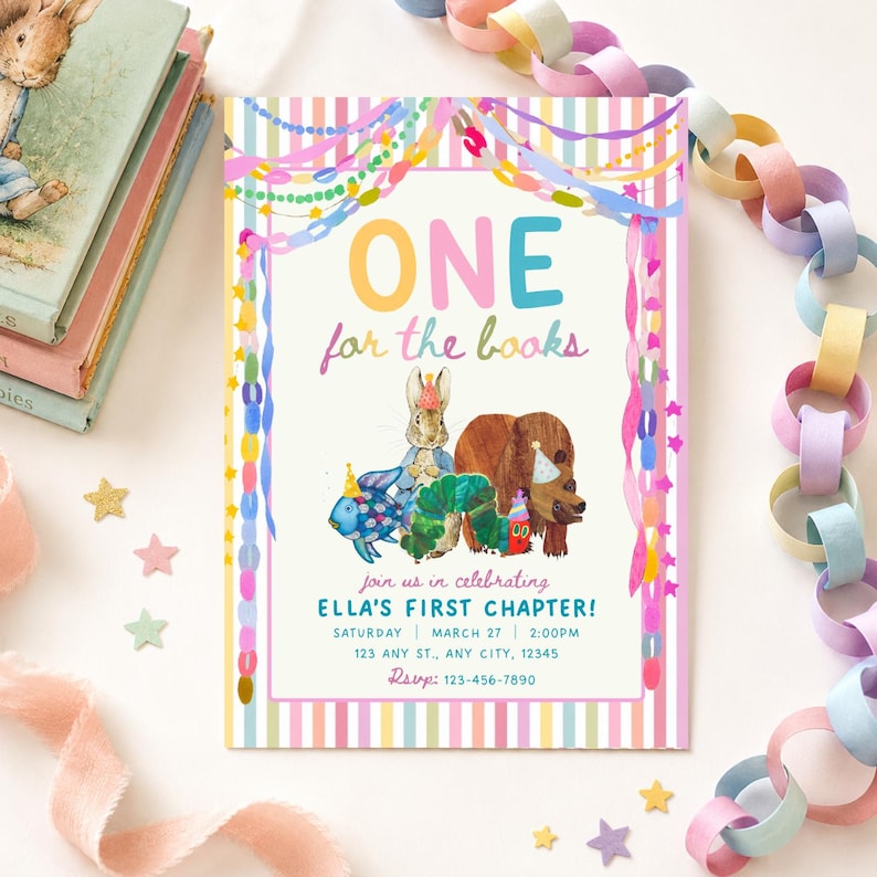 May include: A rectangular party invitation card featuring a striped border and colorful paper chain decorations. The text reads ONE for the books, join us in celebrating ELLA'S FIRST CHAPTER!, with illustrations of a rabbit, bear, fish, and caterpillar.
