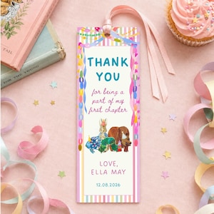 May include: A rectangular paper bookmark with a light pink and white striped border, featuring the text THANK YOU for being a part of my first chapter, LOVE, ELLA MAY, and 12.08.2026. It includes illustrations of animals in party hats and a pink ribbon.