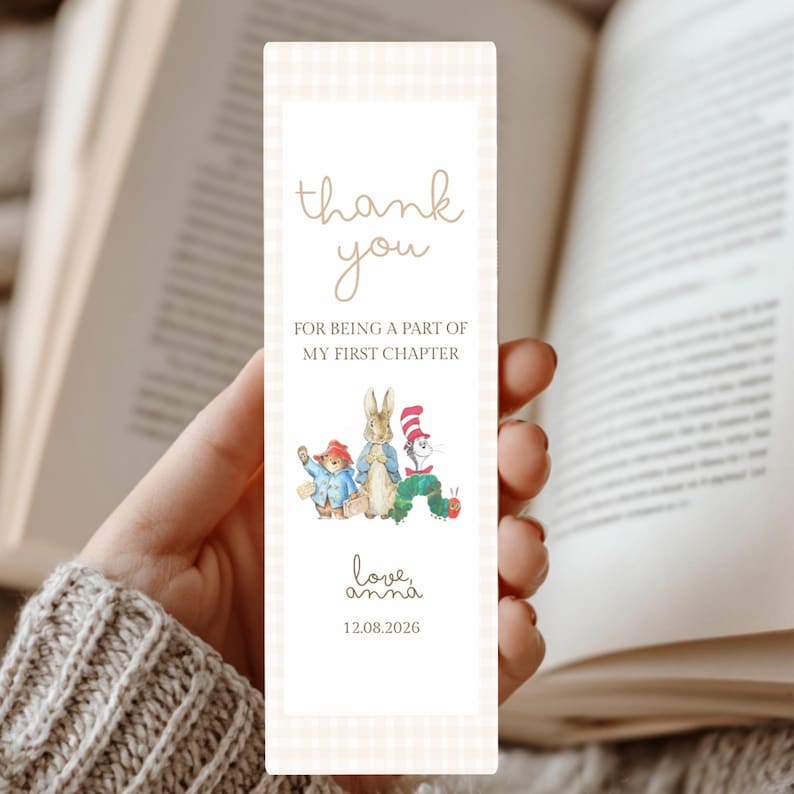 May include: A rectangular bookmark with a light beige gingham border. It features the text "thank you FOR BEING A PART OF MY FIRST CHAPTER", illustrations of storybook characters, "love, anna", and the date "12.08.2026" in brown ink.