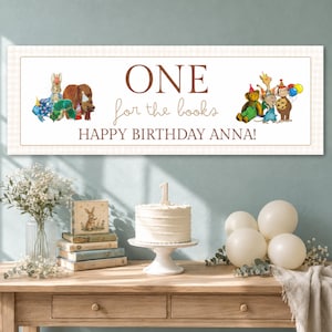 May include: A rectangular banner with a light beige checkered border featuring the text ONE for the books HAPPY BIRTHDAY ANNA! and watercolor illustrations of various animals including a bear, rabbit, and monkey wearing party hats.