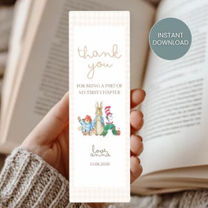 May include: A rectangular bookmark with a beige gingham pattern background. The text "thank you" is written in a cursive font. Below the text is the phrase "FOR BEING A PART OF MY FIRST CHAPTER". The bookmark features illustrations of Paddington Bear, Peter Rabbit, and the Cat in the Hat.