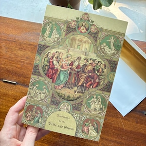 May include: A vintage wedding card with a detailed religious illustration. The card features a central scene of a wedding ceremony, surrounded by smaller circular images. The text "Blessings to the Bride and Groom" is printed on the card.