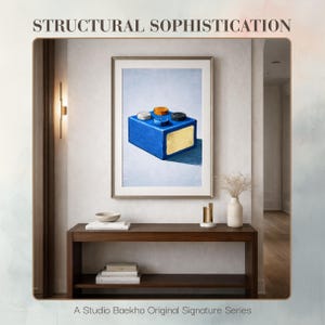 May include: A framed art print featuring a blue rectangular block with colorful circular accents. The artwork is displayed above a dark wood console table with decorative items. The text "STRUCTURAL SOPHISTICATION" and "A Studio Baekho Original Signature Series" are visible.