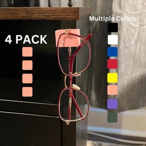 May include: A 4-pack of pink eyeglass holders with a pair of red-framed glasses. The image shows a color chart with multiple color options, including black, white, blue, red, yellow, pink, purple, and green.