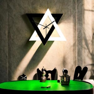 Black and white triangle creative decorative wall clock. Creative wall clock, unique wall clock, modern wall clock