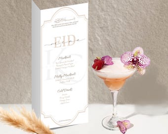 May include: A cocktail glass with a pink drink, topped with foam, raspberries, and a purple and white orchid. A white menu with the word "EID" and drink options is to the left.
