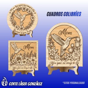 May include: Wooden hummingbird plaques with floral designs and the word "Mom". The plaques have the phrases "You gave me wings to fly" and "Because of you, I can". The text "CUADROS COLIBRÍES" is also visible.