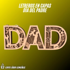 May include: A layered wooden sign spelling DAD with cutouts of tools, gears, a person lifting a child, a tie, glasses, a beer mug, and sports equipment. The text LETREROS EN CAPAS DIA DEL PADRE and CORTE LÁSER GONZÁLEZ is visible on the image.