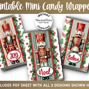 May include: Three printable mini candy wrappers featuring nutcracker illustrations, green holly garlands, and red text reading Joy, Noel, and Believe. The designs include striped and patterned backgrounds with a circular logo reading Instant Necessitees Party Decor Download.