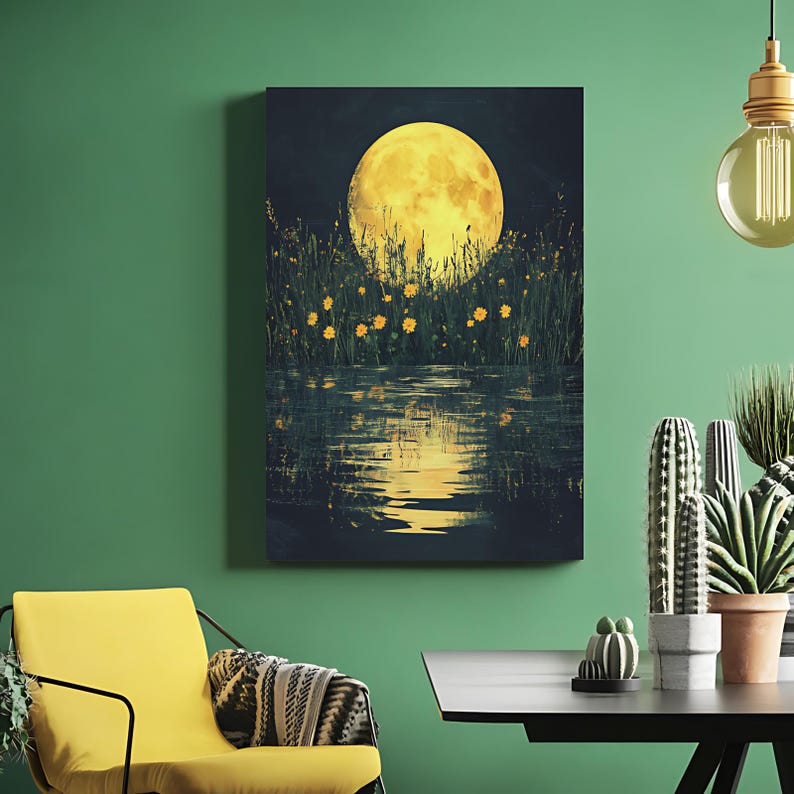 May include: A canvas print depicts a nighttime landscape with a large, yellow moon. Tall grass and small yellow flowers are in the foreground, reflected in the water below. The artwork is displayed on a green wall.