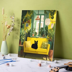 May include: A canvas print of a yellow sofa with a black cat, set in a room filled with plants. The artwork features a window with sunlight and a hanging lamp. The scene is painted in shades of green and yellow.