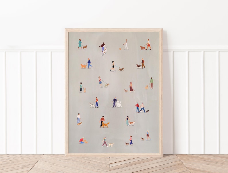 May include: A light gray print with a pattern of people walking their dogs. The people are all wearing different clothes and the dogs are all different breeds. The print is framed in a light wood frame.