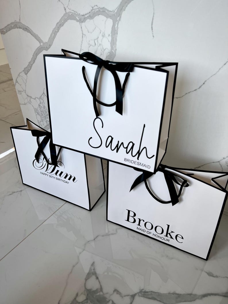 Personalised white gift bag with custom name and elegant rope handles, ideal for bridal party gifts