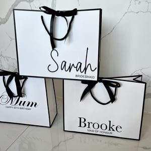 Luxury white gift bag with ribbon bow, personalised for engagement, birthday, or baby shower celebrations