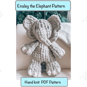 May include: A grey crocheted elephant plush toy with a hand knit PDF pattern. The pattern is titled "Ensley the Elephant Pattern".