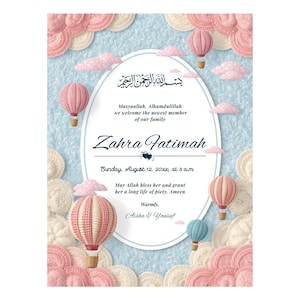 May include: A baby announcement card with a light blue background, featuring pink and white decorative elements. The card includes text in English and Arabic, with the name "Zahra Fatimah" prominently displayed, along with the date and time of the event.