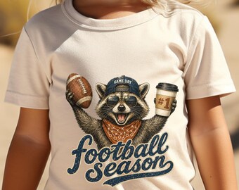 Raccoon Holding Football and Coffee Football Season TShirt | Sports Fan Tee