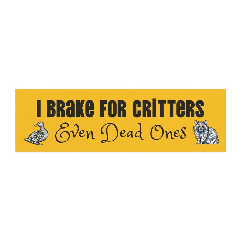May include: Yellow bumper sticker with black text that reads "I Brake For Critters Even Dead Ones". A cartoon duck and raccoon are on either side of the text.