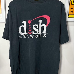 May include: Black t-shirt featuring the Dish Network logo in white and red. The logo includes the word "dish" in a distinctive font, with a red arc and a red dot above the letter "h". The word "NETWORK" is below the word "dish".