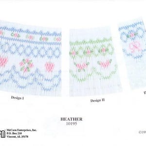 May include: Three white fabric swatches featuring smocking embroidery patterns labeled Design I, Design II, and Design III. The patterns include blue, green, and pink floral and lattice motifs. Text includes HEATHER 10195 and ellen mccarn.