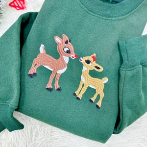 Felpa natalizia Rudolph ricamata: Felpa girocollo con renna