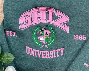 Sudadera bordada Shiz, Suéter de la Universidad Wizard Shiz, Varita mágica de escoba Wicked Defy Gravity, La mejor película de Wicked, Fan de Wicked