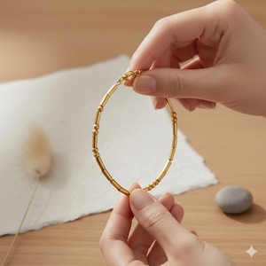 May include: A white ceramic mug with a black handle and the text "But First, Coffee" in a bold, black font. The mug is set against a blurred background, suggesting a cozy setting. The mug appears to be approximately 4 inches tall.