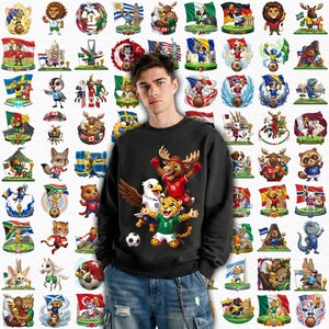 Op de afbeelding: Een zwart sweatshirt met een afbeelding van een adelaar, een eland en een jaguar in voetbaltenues. Rondom het sweatshirt staan verschillende cartoonafbeeldingen van dieren die voetballen, elk met een vlag.